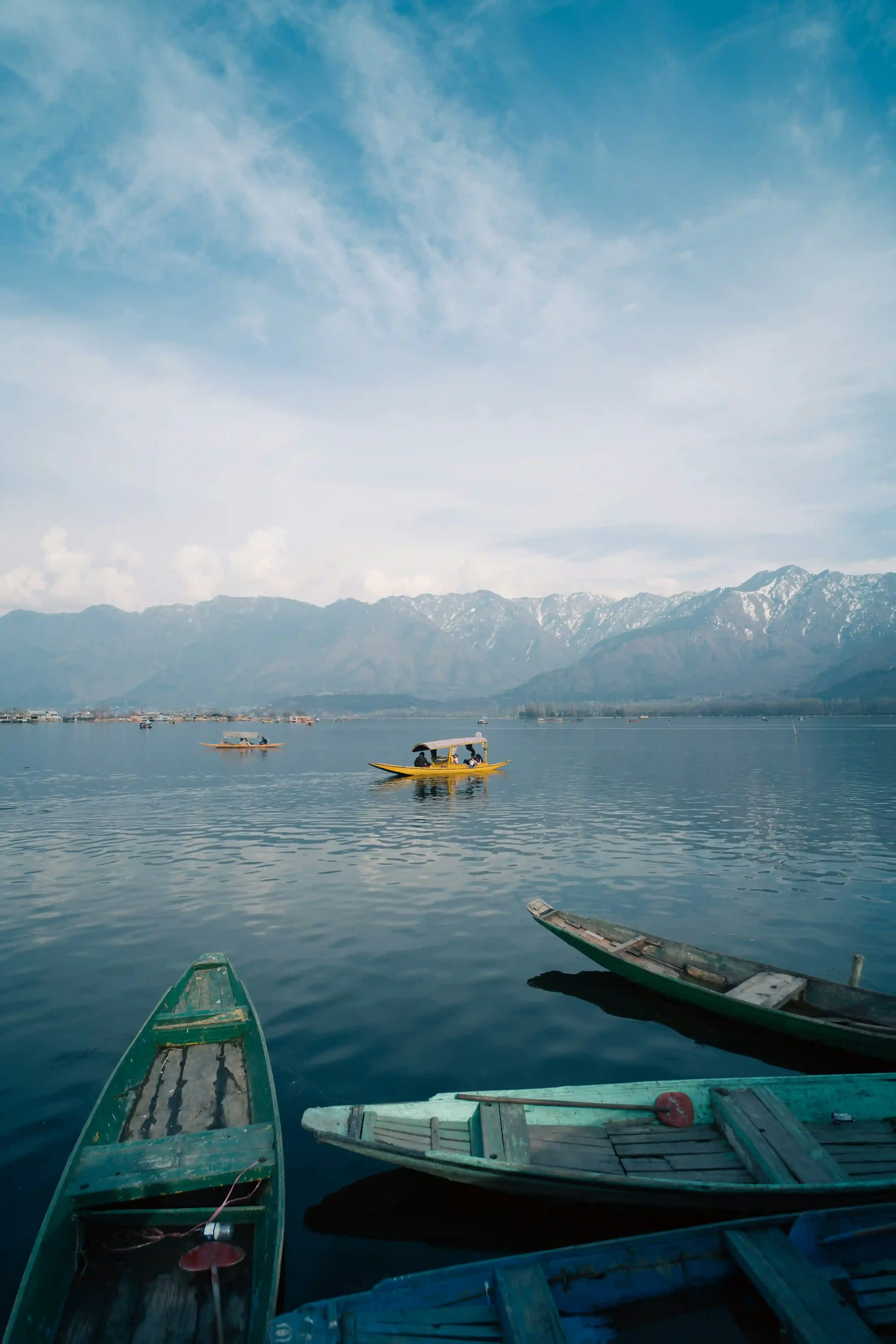 Traditional Wooden Houseboats Boats on Dal Lake between Mountains in Kashmir
